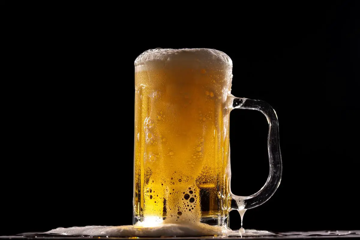 Image of Oktoberfest beer being poured into a traditional German beer stein